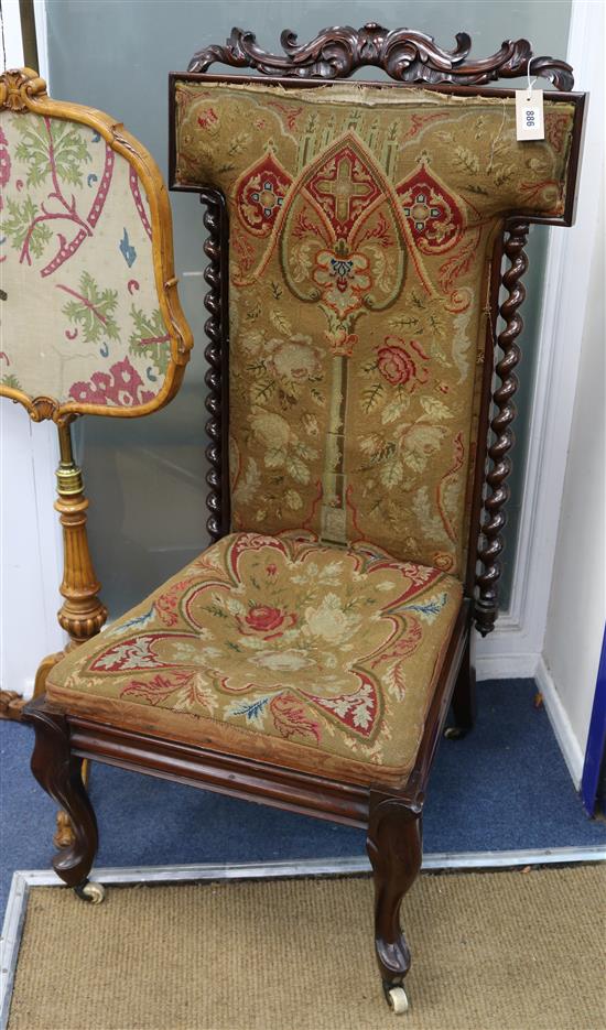 A Victorian walnut prie dieu, with foliate scroll cresting and spiral turned columns to the back, the seat and back